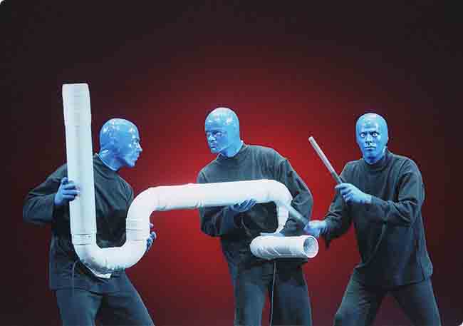 Blue Man playing the Drum-Bone